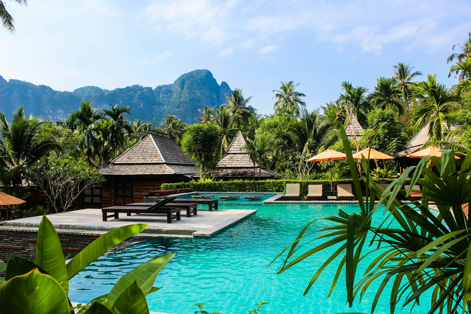 Pool terrace surrounded by greenery